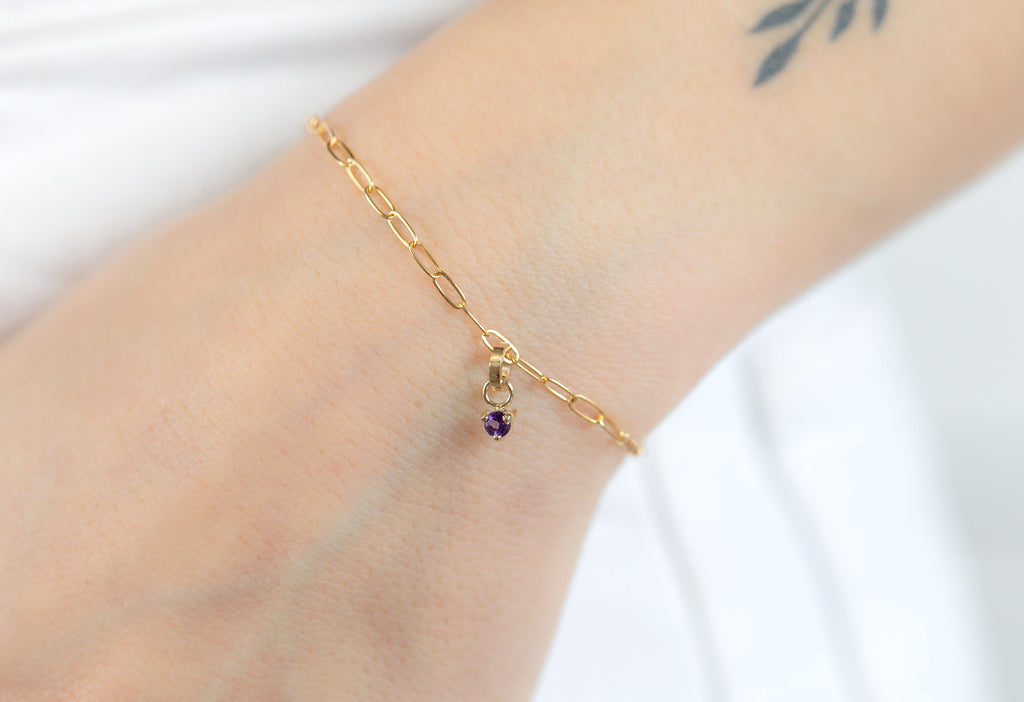 10k Yellow Gold Amethyst Birthstone Charm on Charm Bracelet on Model