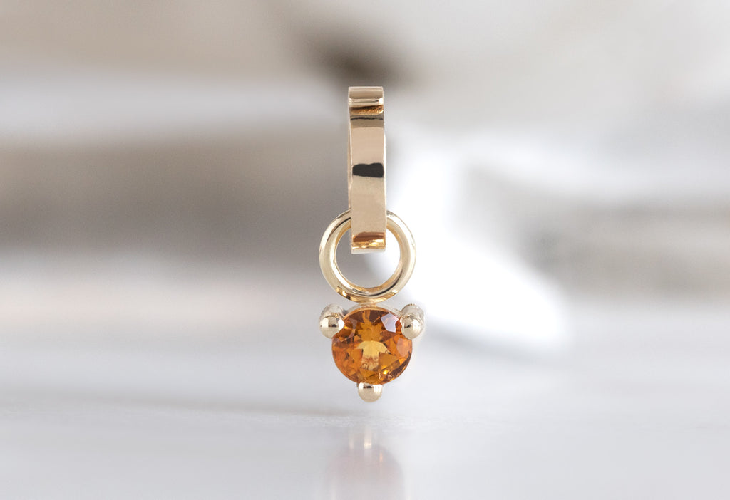 10k Yellow Gold Citrine Birthstone Charm on White Marble TIle