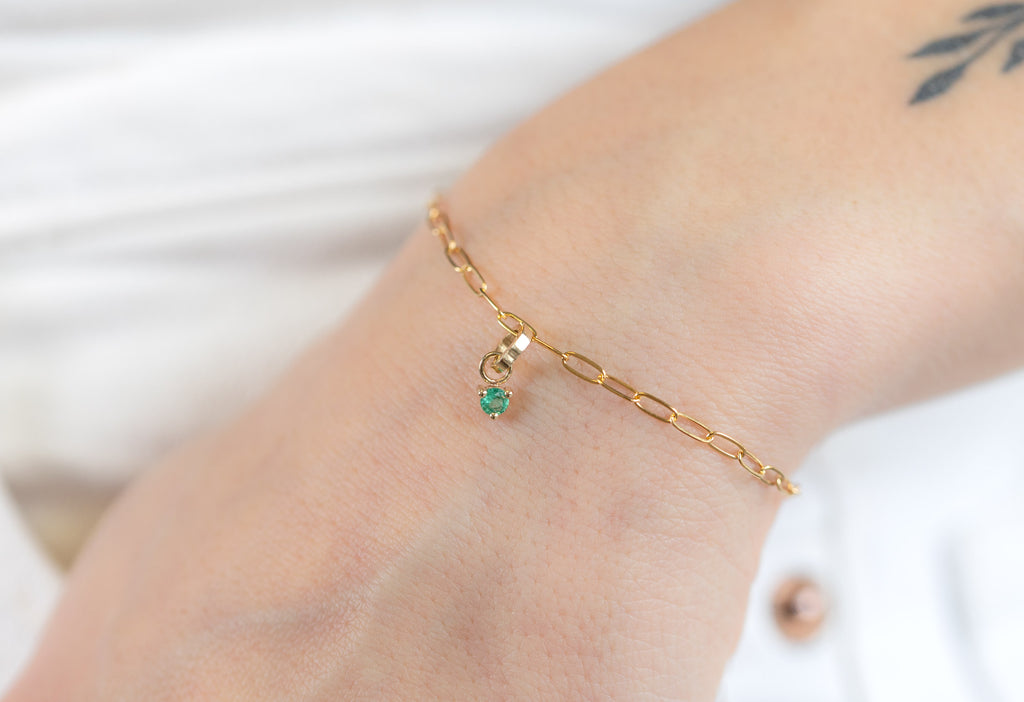 10k Yellow Gold Emerald Birthstone Charm  on Charm Bracelet on Model