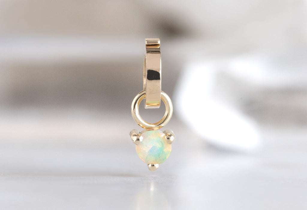 10k Yellow Gold Opal Birthstone Charm on White Background