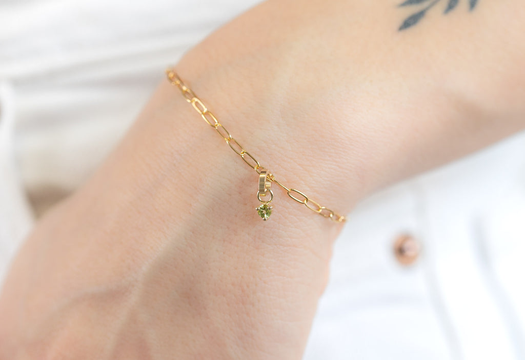 10k Yellow Gold Peridot Birthstone Charm  on Charm Bracelet on Model