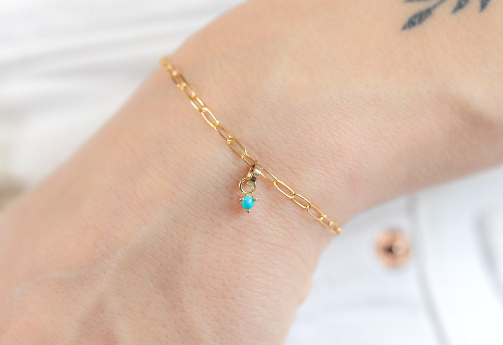 Yellow Gold Turquoise Birthstone Charm on Charm Bracelet on Model