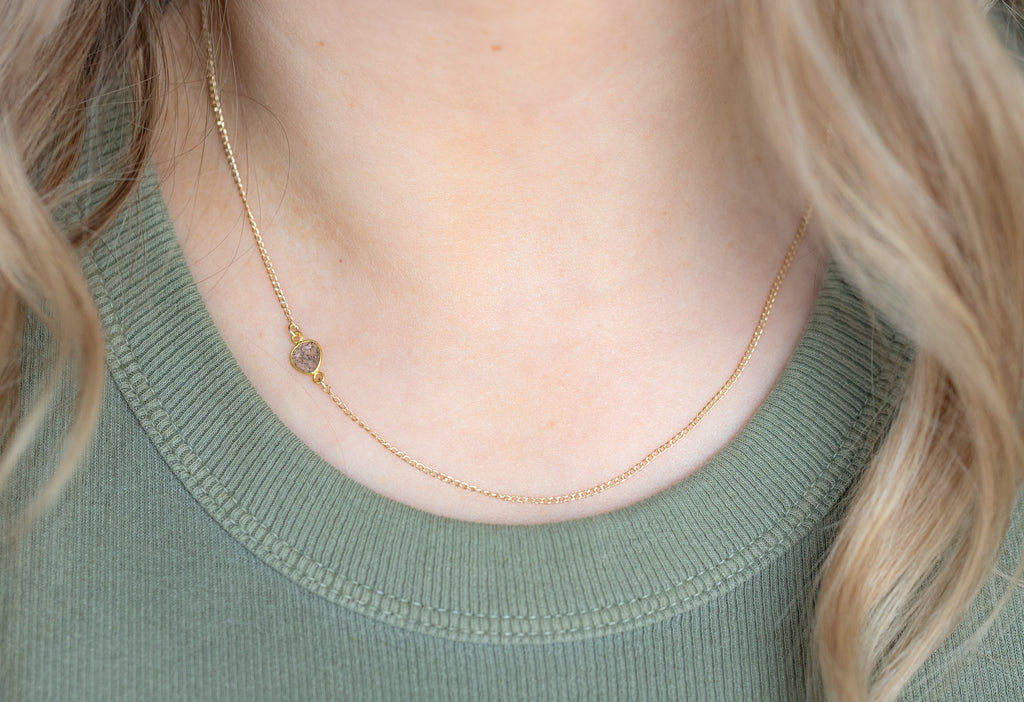 Yellow Gold Asymmetrical Diamond Slice Necklace on Model in Green Ripped Tank