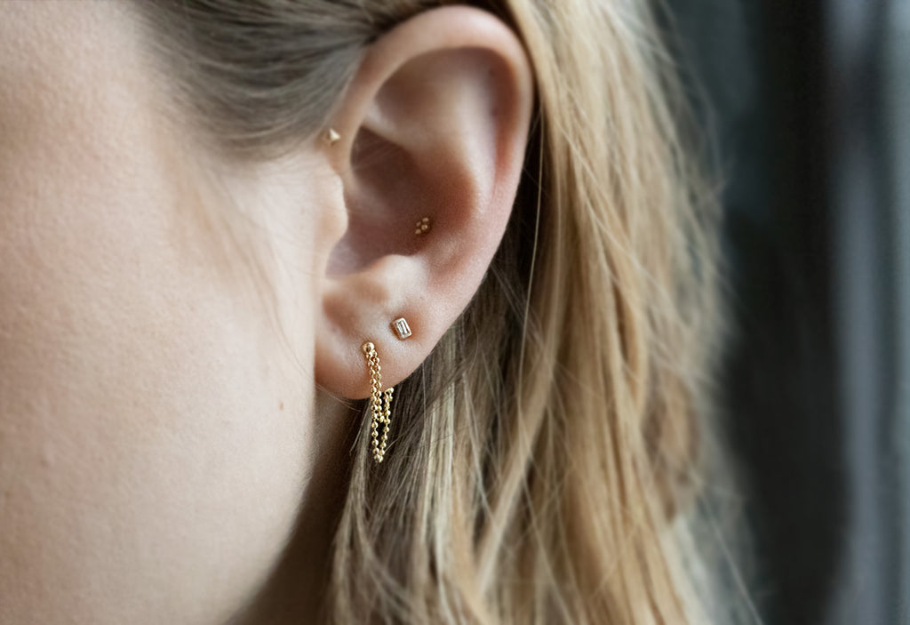 Diamond-Cut Chain Earrings Stacked on Model