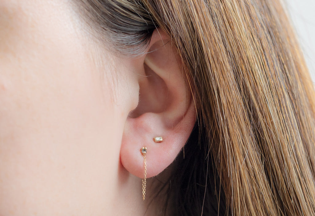 Yellow Gold Diamond Sunburst Chain Hoops Stacked on Model