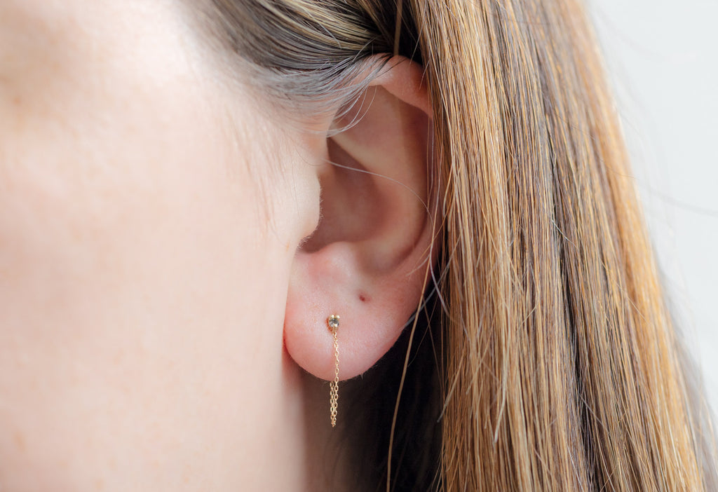 Yellow Gold Diamond Sunburst Chain Hoops on Model