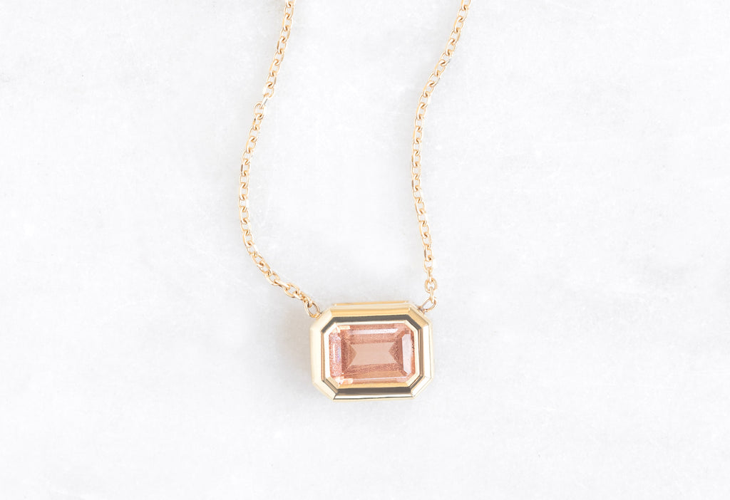 Emerald-Cut Sunstone Necklace on White Marble