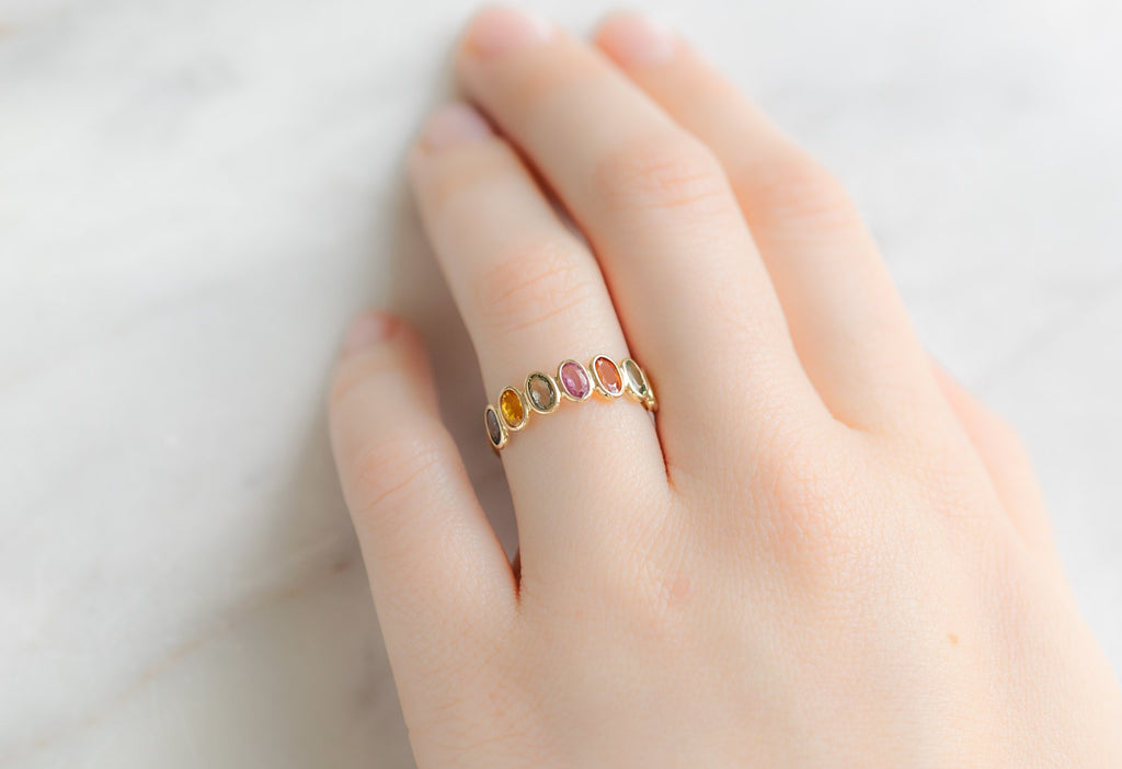 Rainbow Gemstone Eternity Band on Model