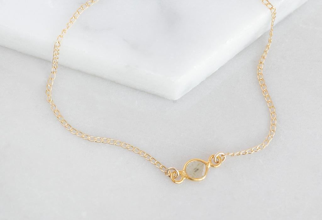 Yellow Gold Natural Diamond Slice Bracelet on White Marble Tile