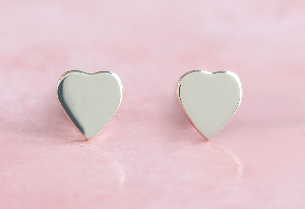 10k Yellow Gold Sweetheart Stud Earrings on Pink Background