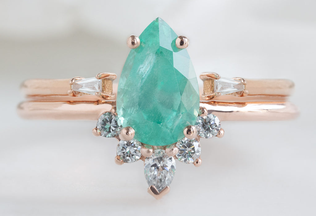 The Aster Ring with a Pear-Cut Emerald with Open Cuff White Diamond Baguette Stacking Band