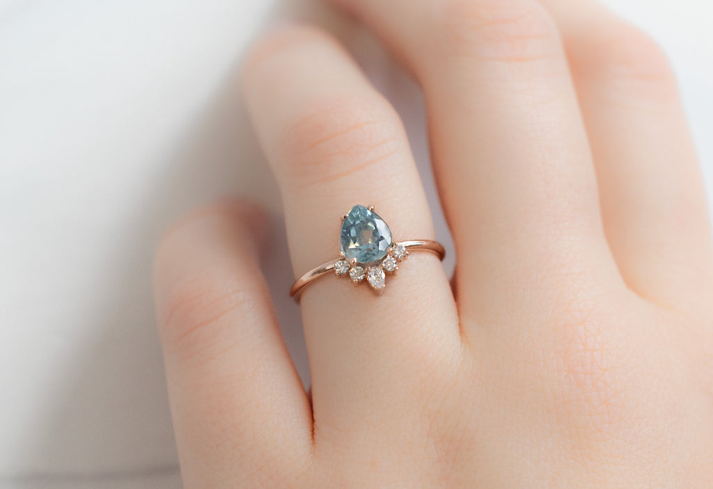 The Aster Ring with a Pear-Cut Montana Sapphire on Model