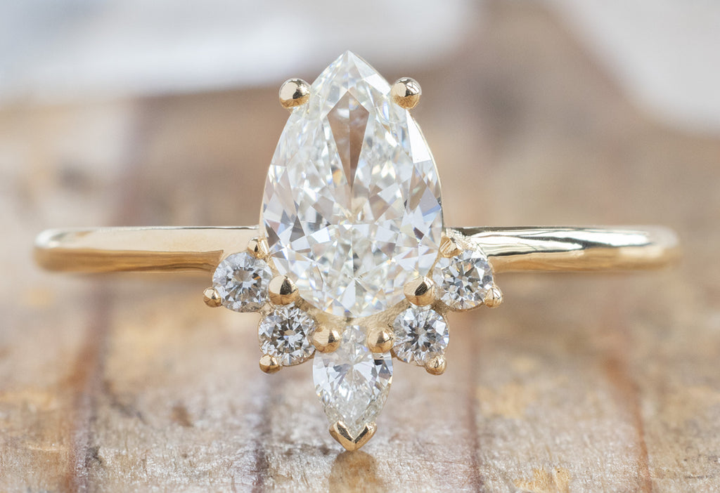 The Aster Ring with a Pear-Cut White Diamond