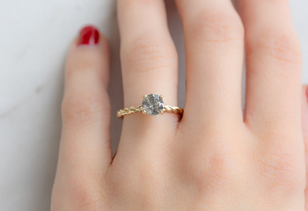 The Braided Band Ring with a Round Salt and Pepper Diamond on Model