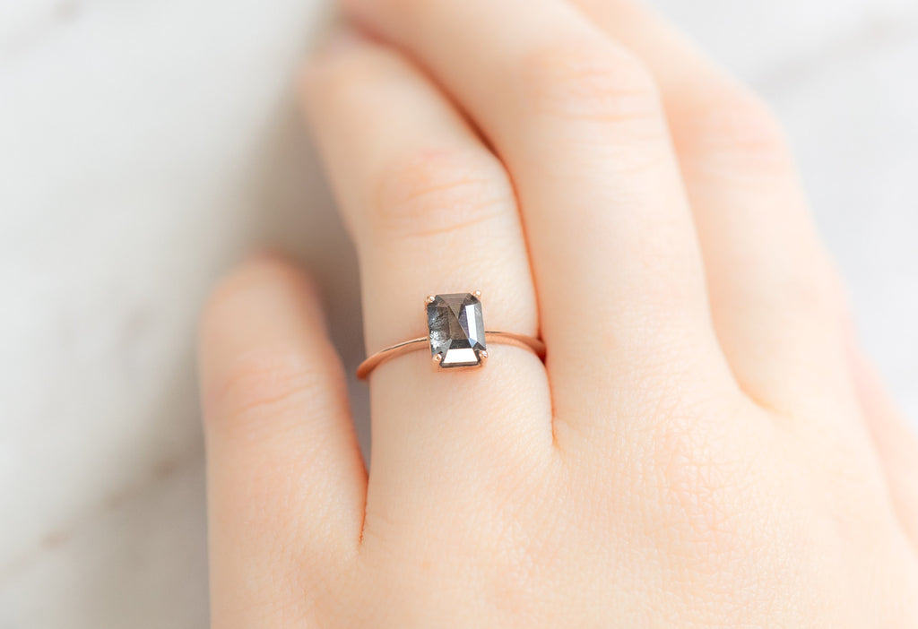 The Bryn Ring with an Emerald-Cut Black Diamond on Model