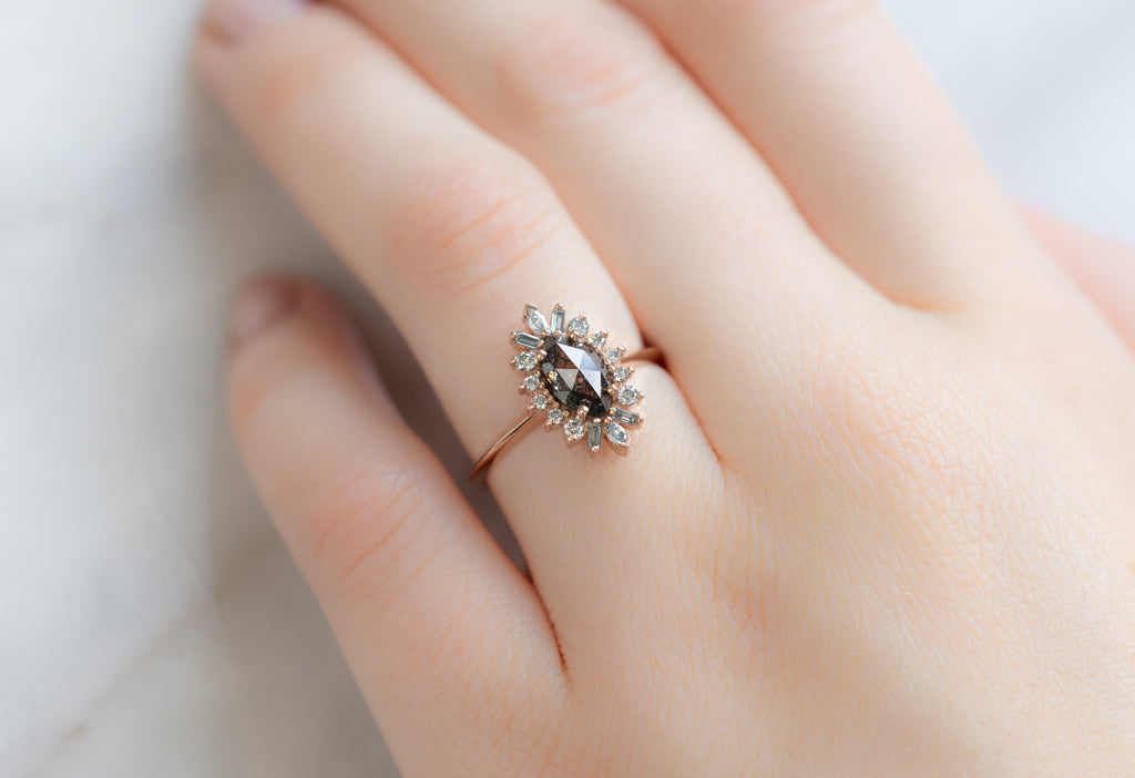 The Camellia Ring with a Black Marquise Diamond on Model