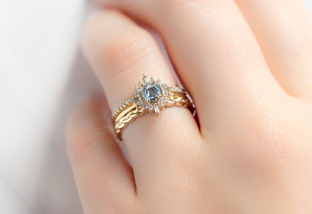 The Compass Ring with a Montana Sapphire with Stacking Bands on Model