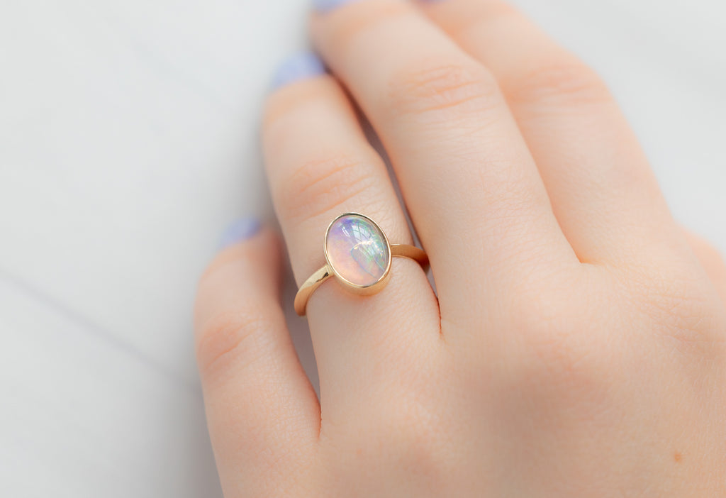 The Hazel Ring with an Australian Opal on Model