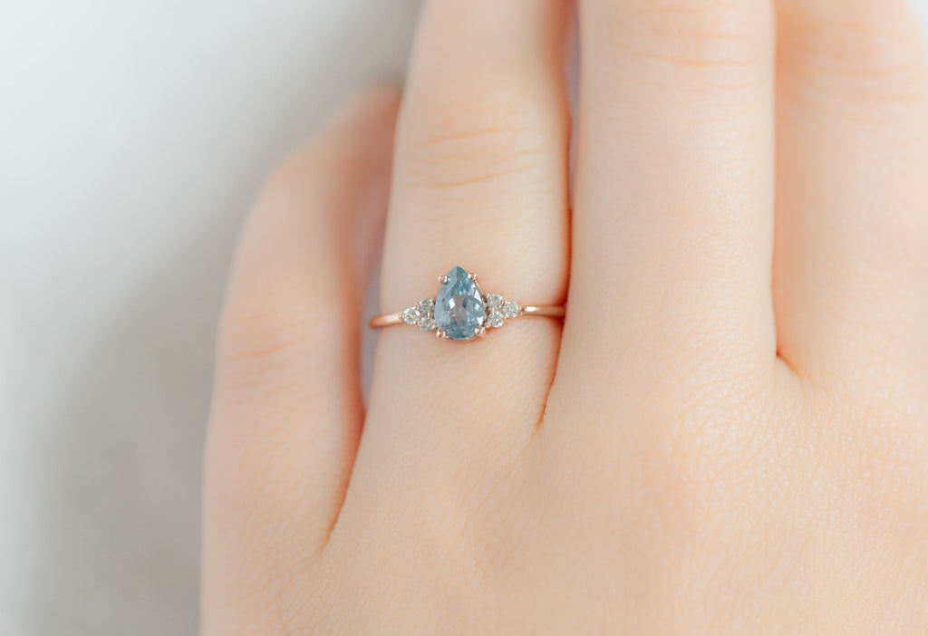 The Ivy Ring with a Pear-Cut Montana Sapphire on Model