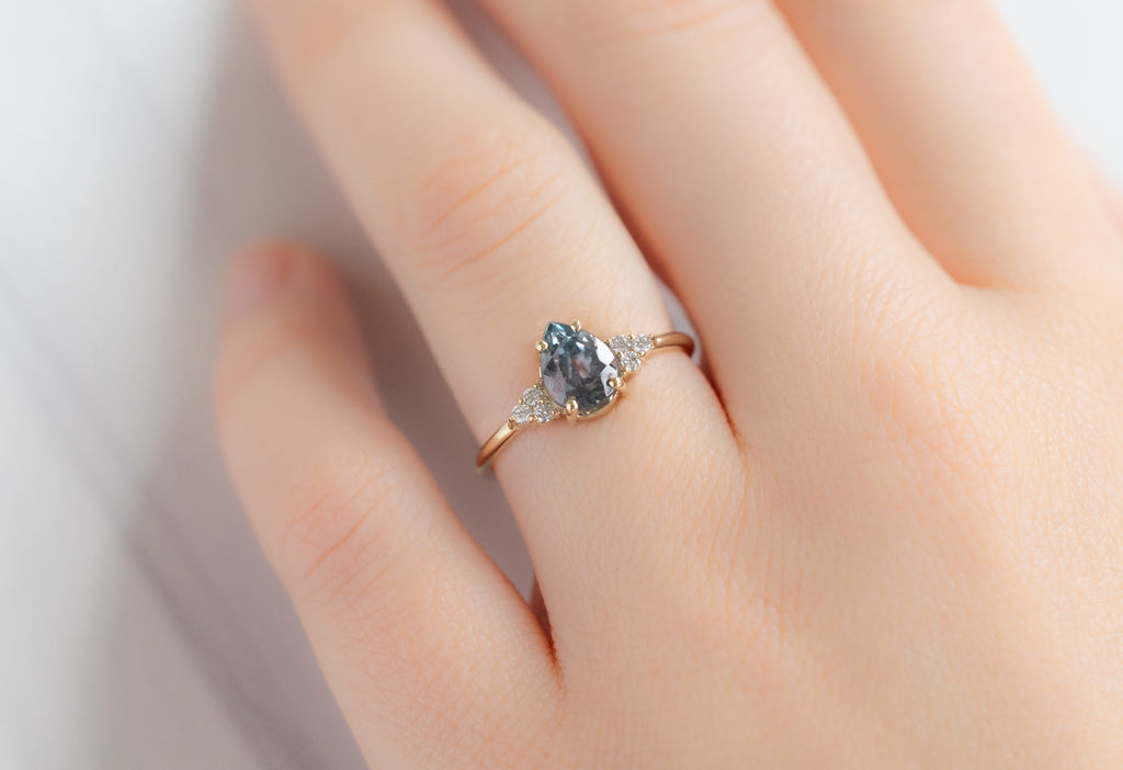 The Ivy Ring with a Pear-Cut Montana Sapphire on Model