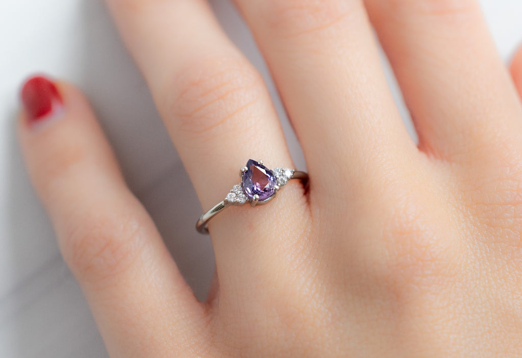 The Ivy Ring with a Pear-Cut Violet Sapphire on Model