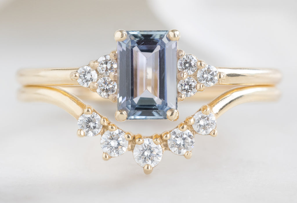 The Ivy Ring with an Emerald-Cut Tanzanite with Round Diamond Sunburst Stacking Band