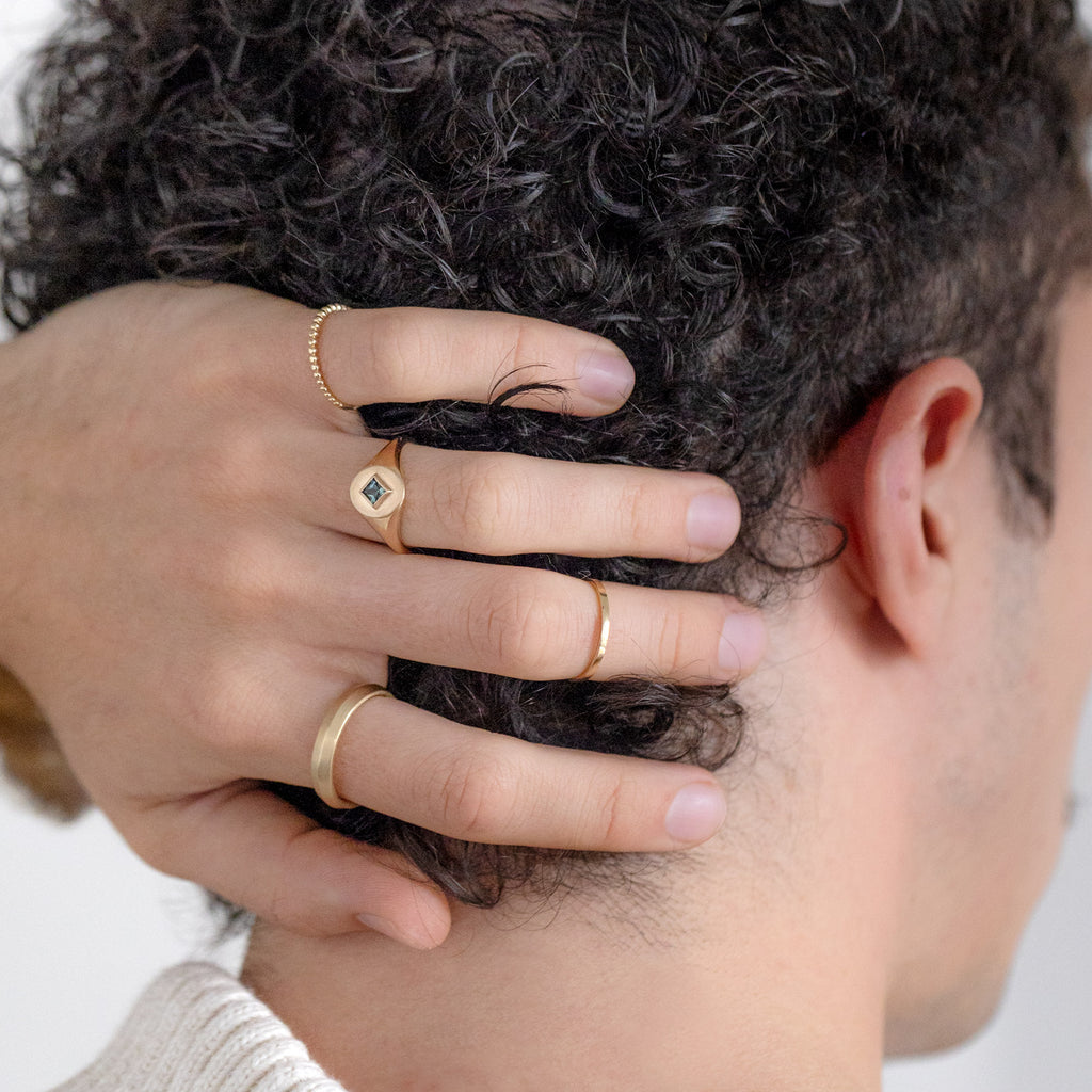 The Kite-Shaped Montana Sapphire Signet Ring Stylized on Model