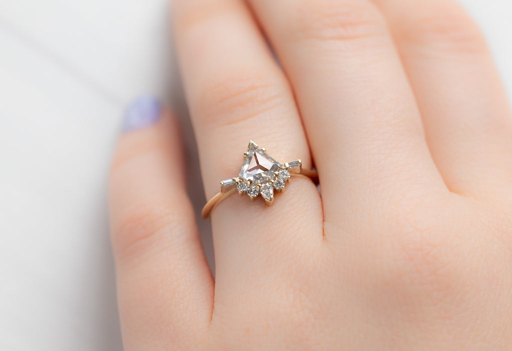 The Posy Ring with a Shield-Cut White Diamond on Model