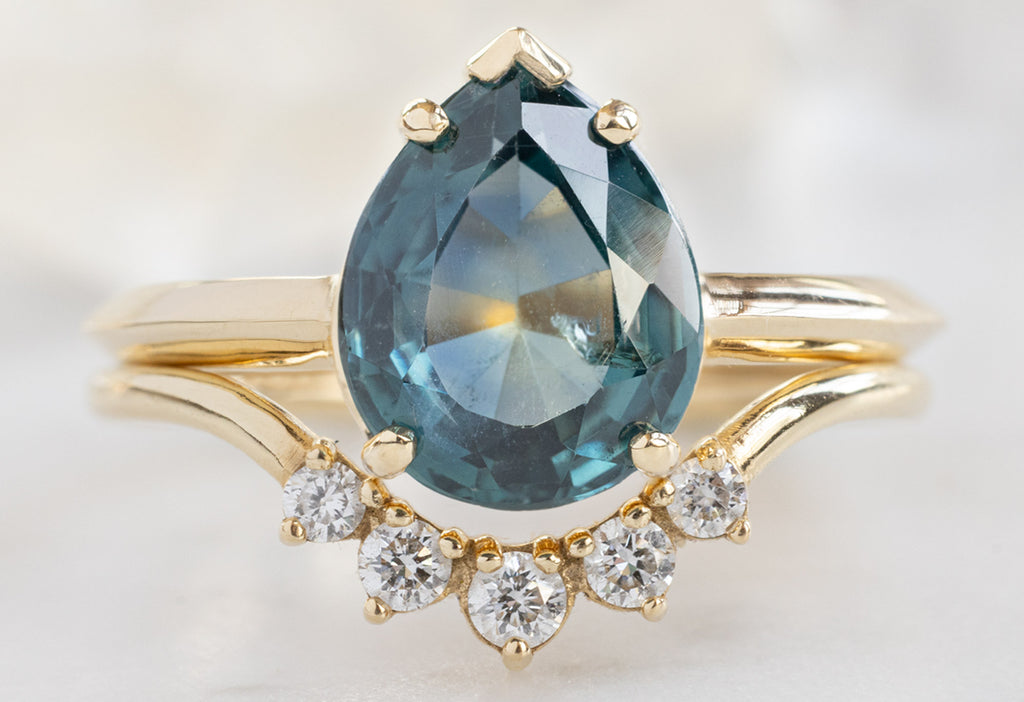 The Sage Ring with a Pear-Cut Montana Sapphire with Round White Diamond Sunburst Stacking Band