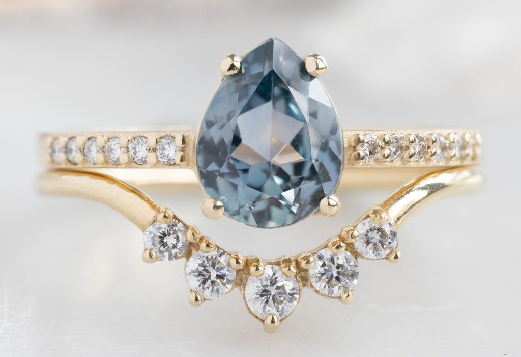 The Willow Ring with a Pear-Cut Montana Sapphire with Round Diamond Sunburst Staclomg Bamd