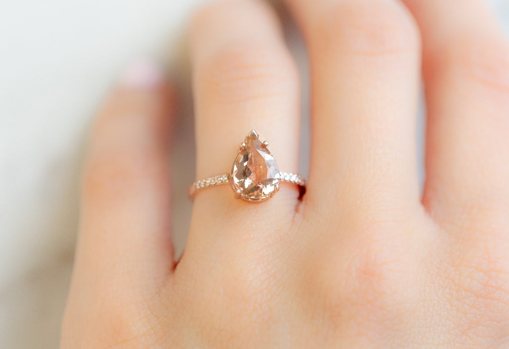 The Willow Ring with a Pear-Cut Sunstone on Model