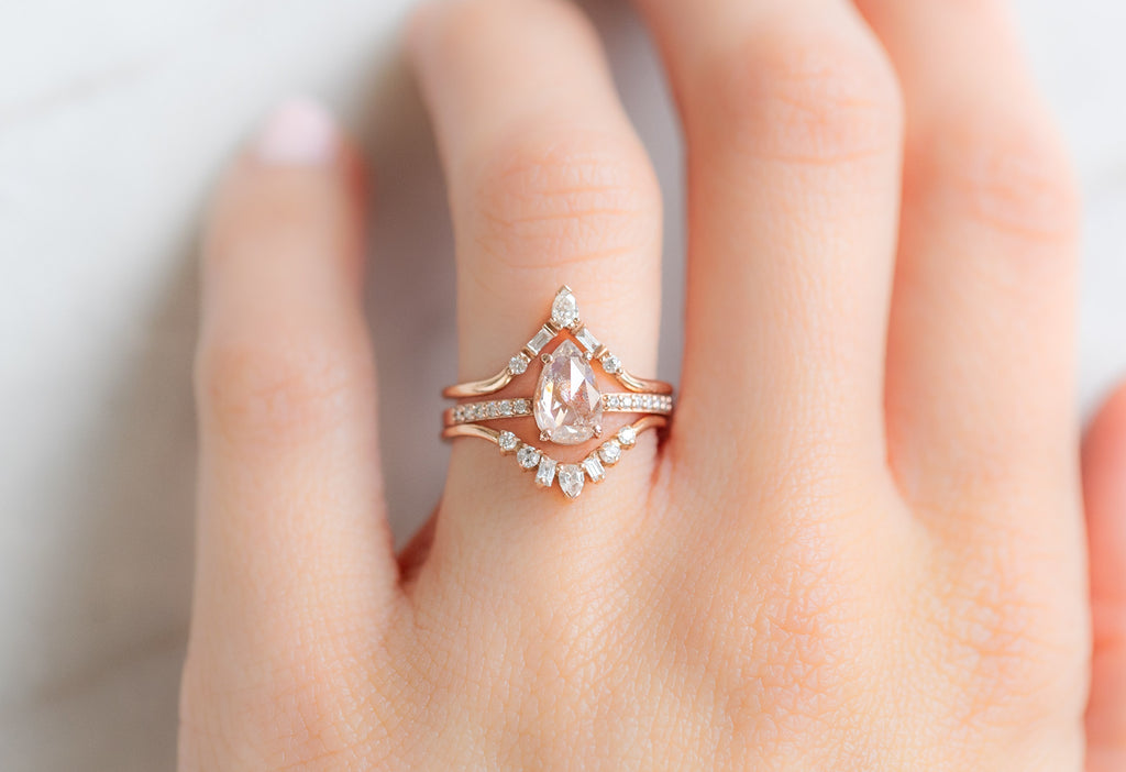 The Willow Ring with a Rose-Cut Pink Diamond with White Diamond Stacking Bands on Model