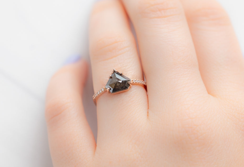 The Willow Ring with a Shield-Cut Black Diamond on Model