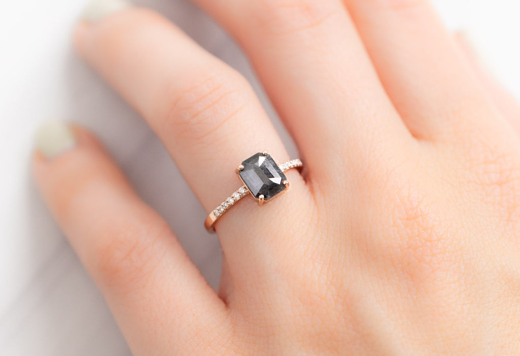 The Willow Ring with an Emerald-Cut Black Diamond on Model