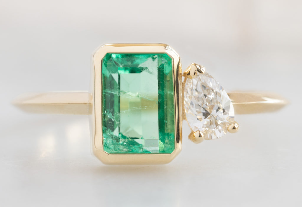 The You & Me Ring with an Emerald + White Diamond