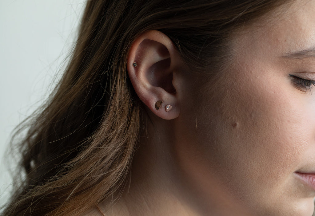 model wearing rose gold sweetheart diamond stud earrings