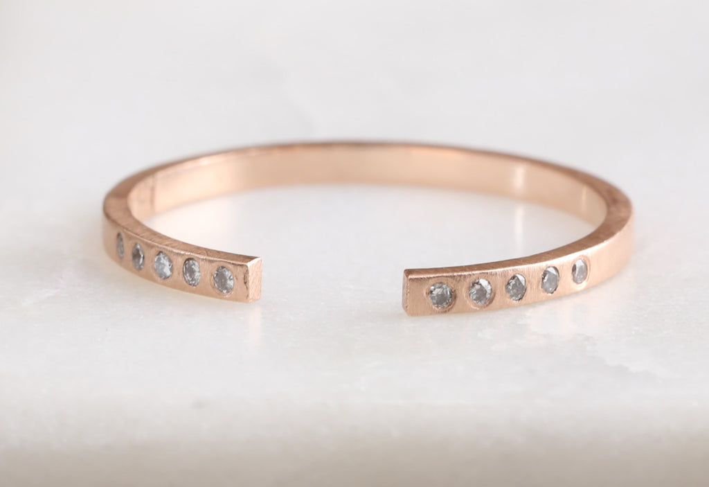 Rose Gold Three Open Cuff Flush Set Pavé Diamond Band on White Marble Tile