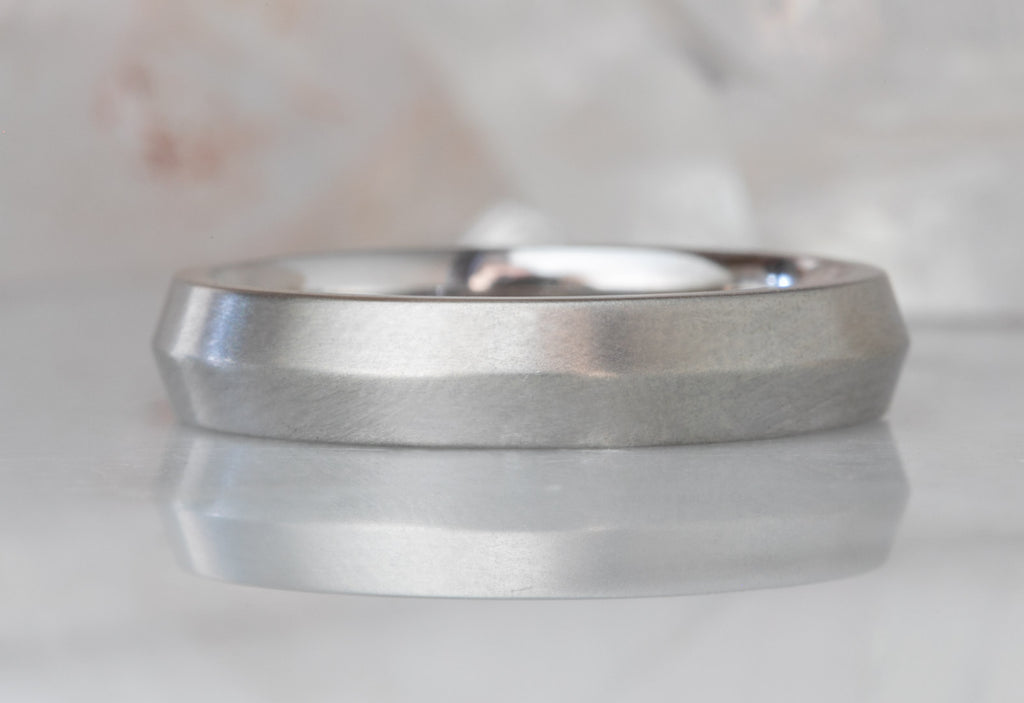 White Gold The Knife Edge Wedding Band on White Marble Tile