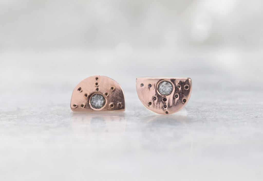 rose gold Half Moon Stardust Stud Earrings on white marble tile