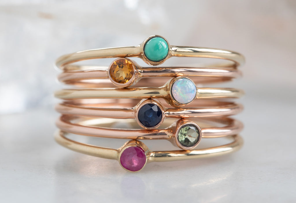 Custom Birthstone Stacking Rings Stacked on Top of Each Other