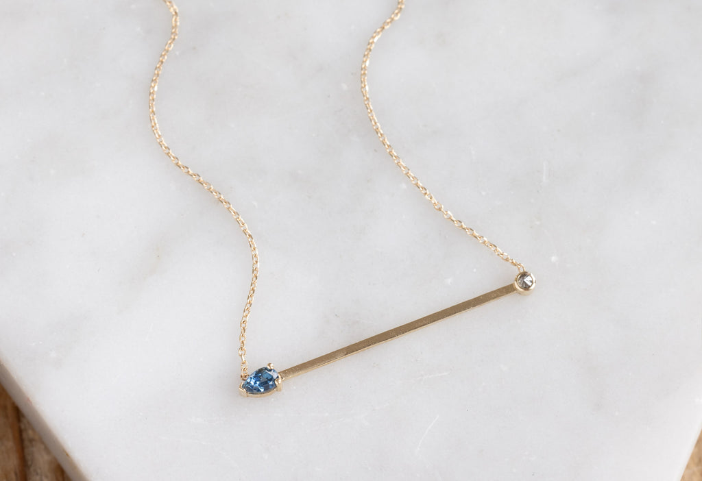 Montana Sapphire + Diamond Necklace on Marble