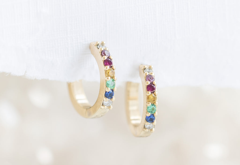 Pavé Rainbow Huggie Hoops on Paper