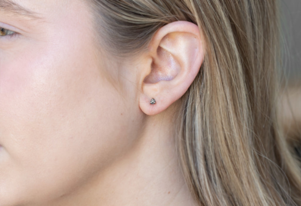 Teensy Black Diamond Hexagon Stud Earring on Model