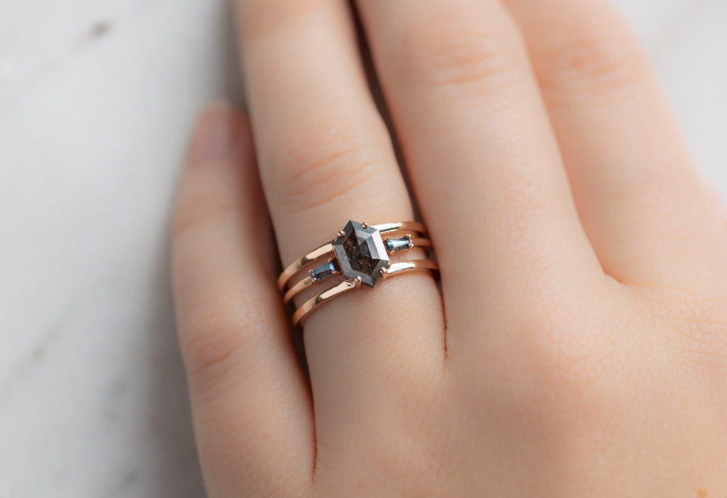 The Poppy Ring with a Black Hexagon Diamond with Stacking Band on Model