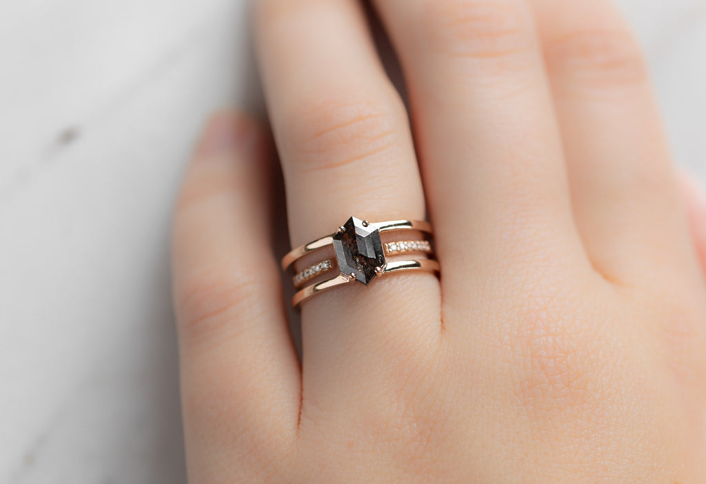 The Poppy Ring with a Black Hexagon Diamond with Stacking Band on Model