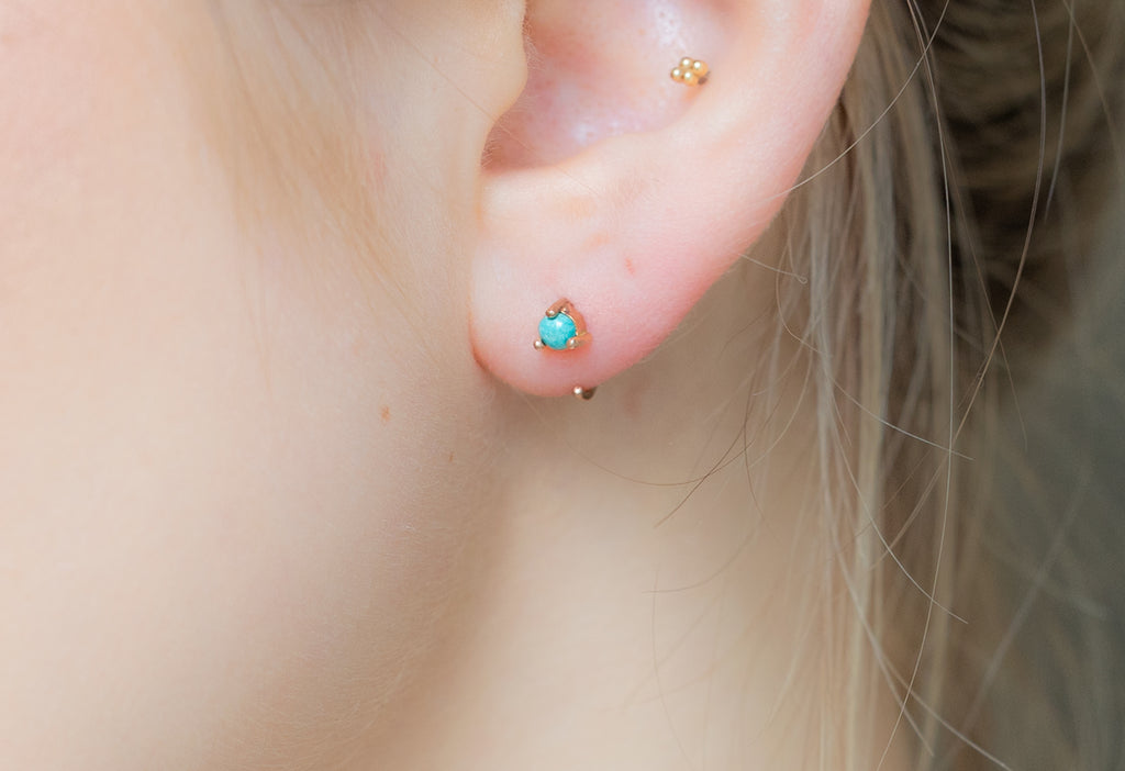 Turquoise Huggie Earrings on Model