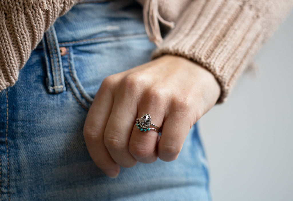 Turquoise Sunburst Wedding Band Stacked with Engagement Ring on Model