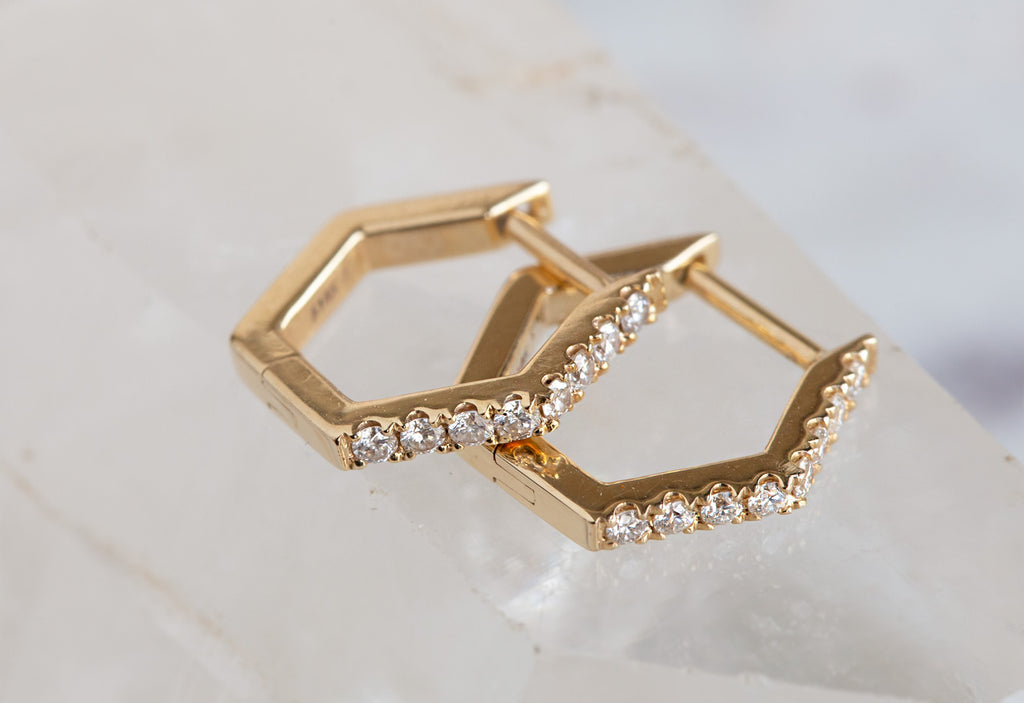 Pavé Diamond Hexagon Hoops laying flat on white crystal