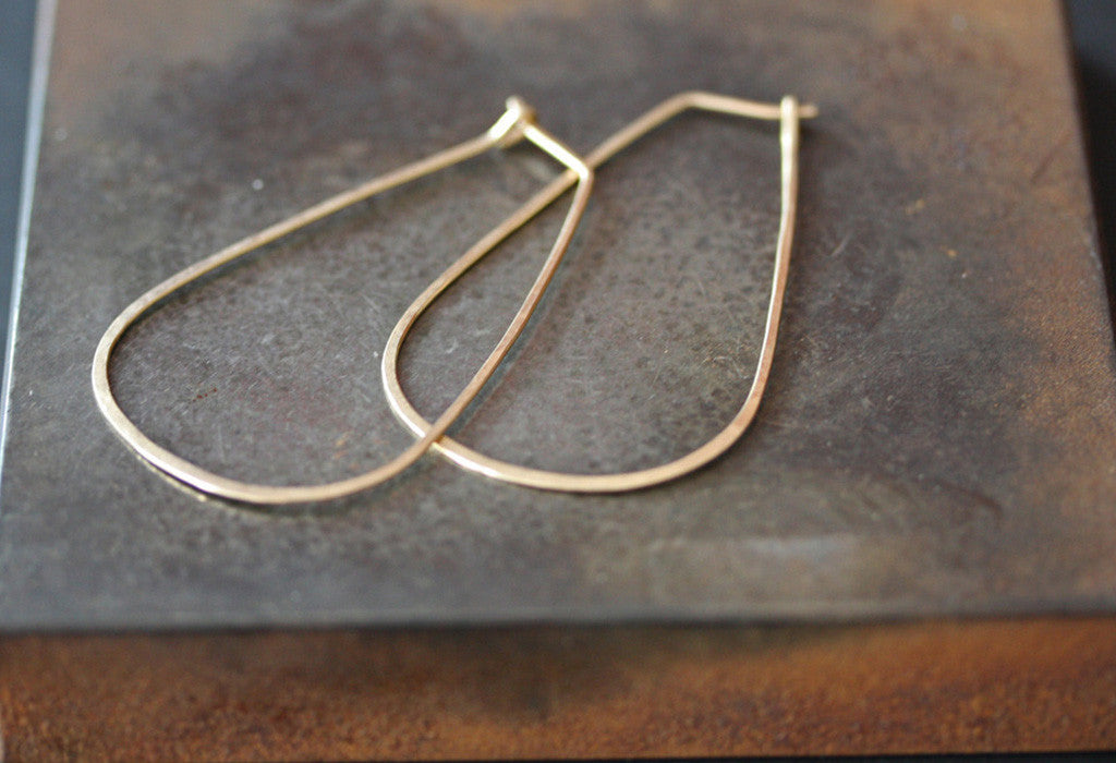 Large Horseshoe Hoop Earrings on burnt orange tile