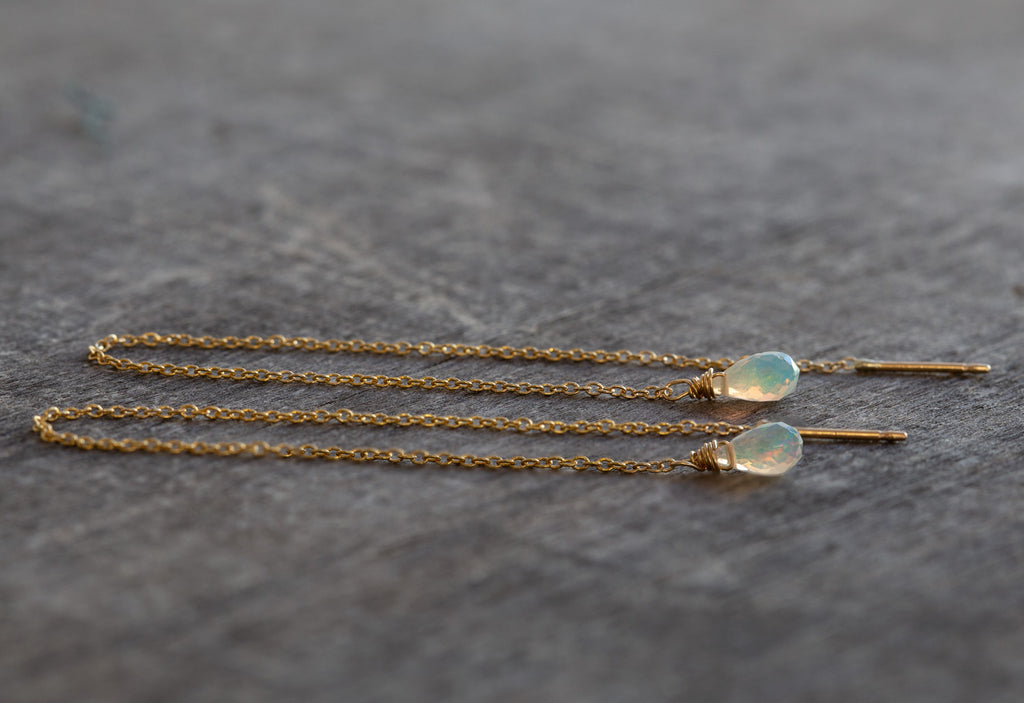 yellow gold Natural Opal Thread Earrings on wood table